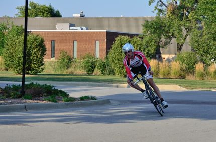 Cyclist racer leaning into turn