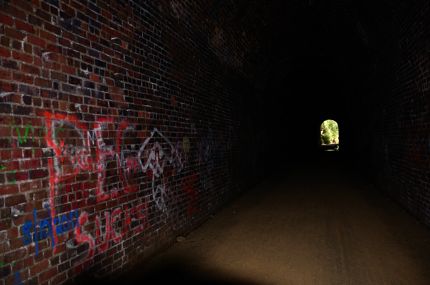 Graffiti inside Badger State Trail tunnel