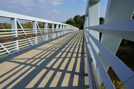 Railings and shadows from steel bridge