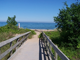Wooden path and scenic view of Lake Michigan