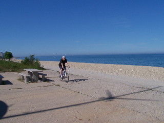 Bike rider and view of Lake Michigan