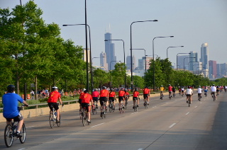 Red Shirt Team of Cyclists on Bike The Drive