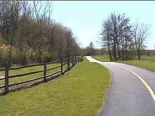 Deer Grove bike path by wooden fence