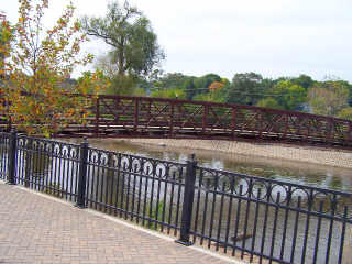 Brick walkway and rail by Fox River