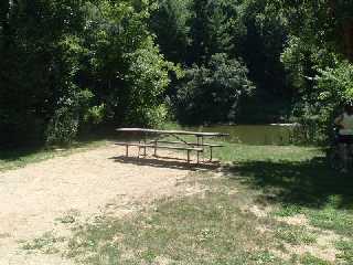 Picnic table are placed along Red Cedar Trail